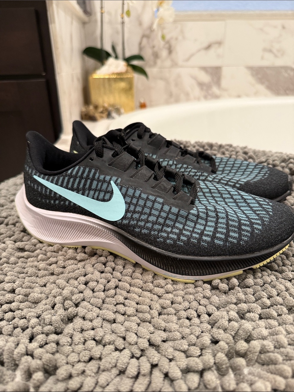 Nike Black Running Sneakers with Light Blue Swoosh